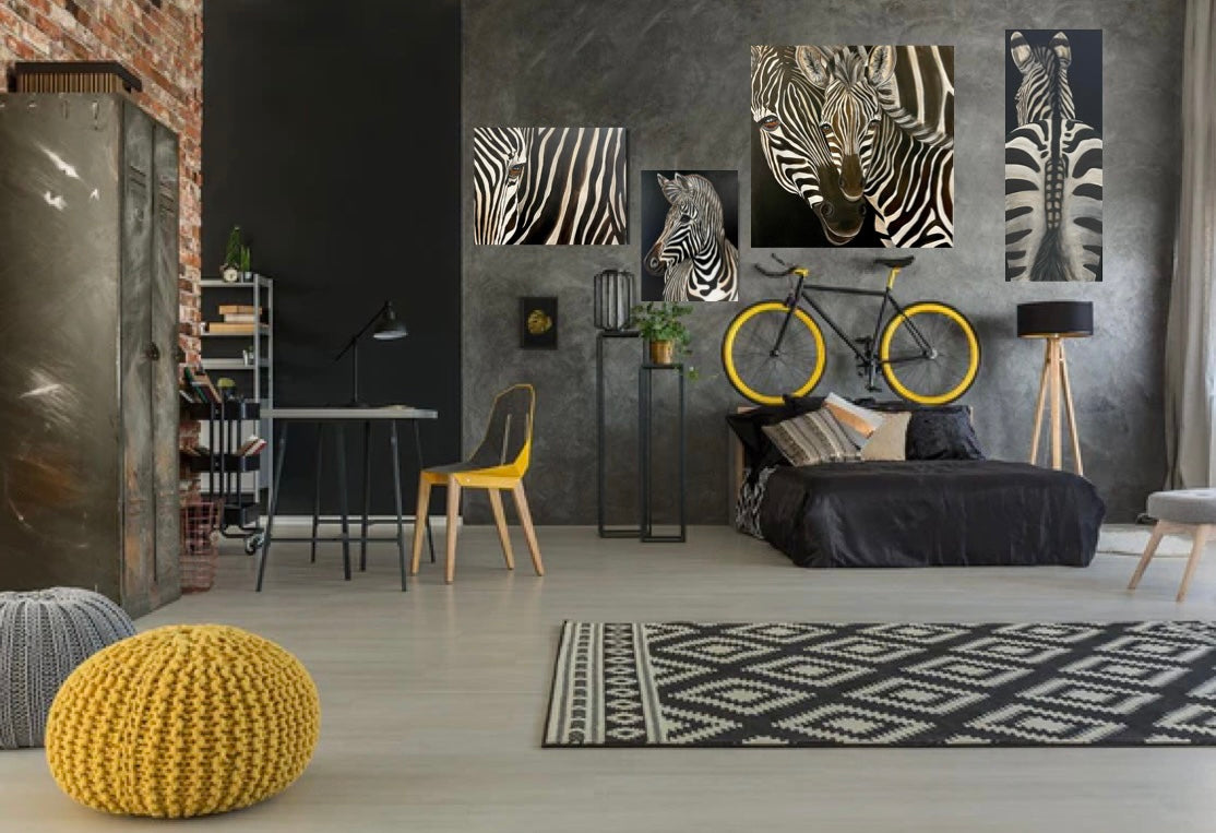 A collection of original Zebra art by Terrinye in modern shades of gray room with splashes of yellow. A bicycle with yellow rims hangs on the wall.